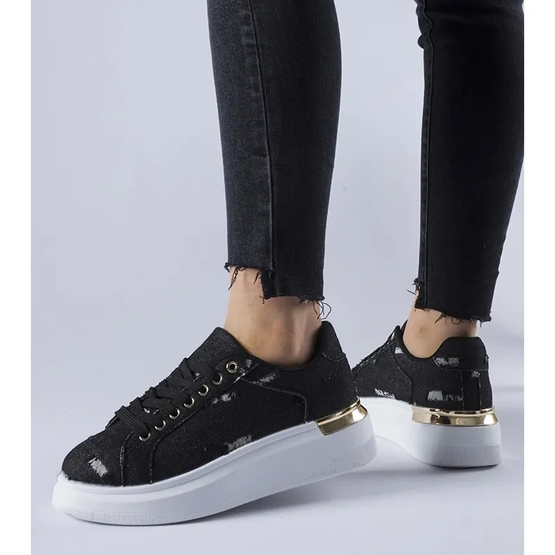 Black platform sneakers by Osson