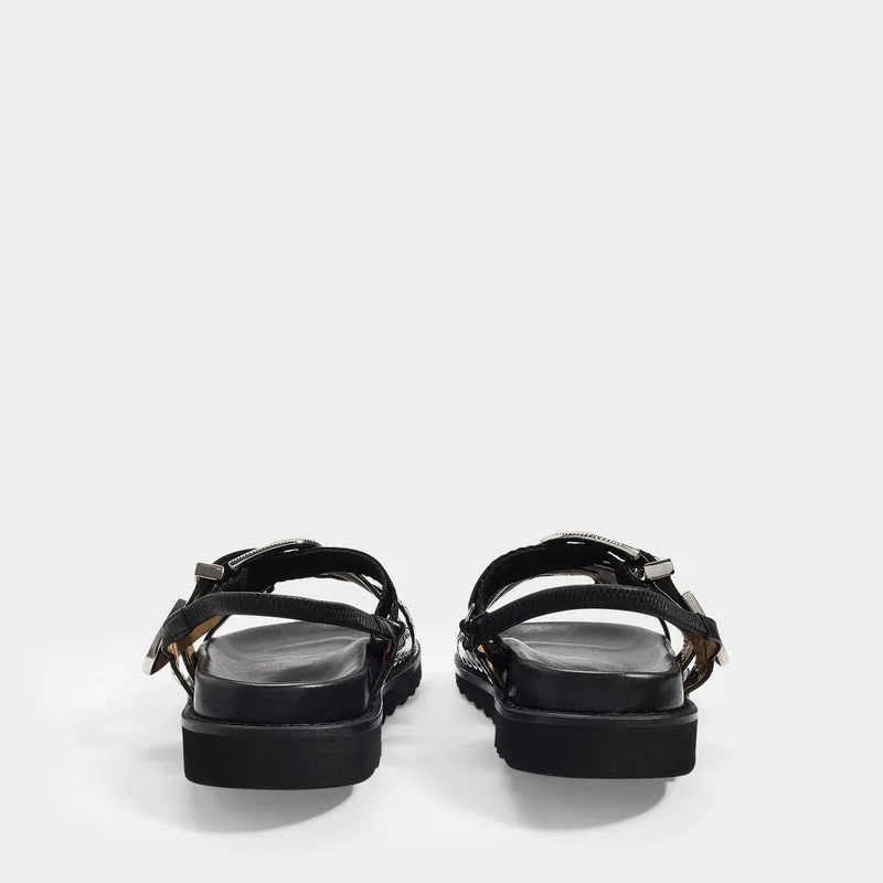 Flat Sandals in Black Leather with Metallic Straps