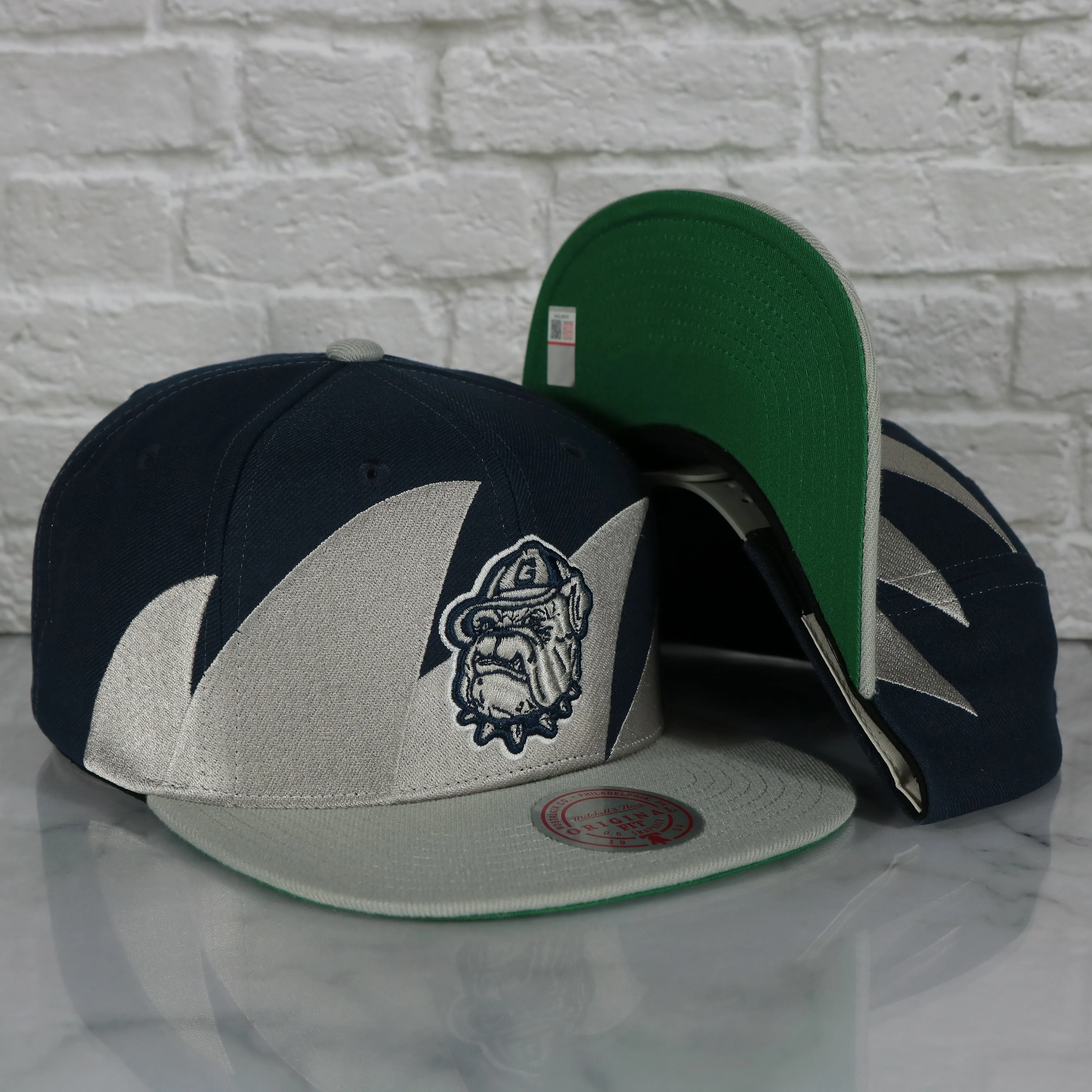 Georgetown University Hoyas Mitchell and Ness Snapback Hat - Vintage Retro Sharktooth Design - Gray/Navy Blue