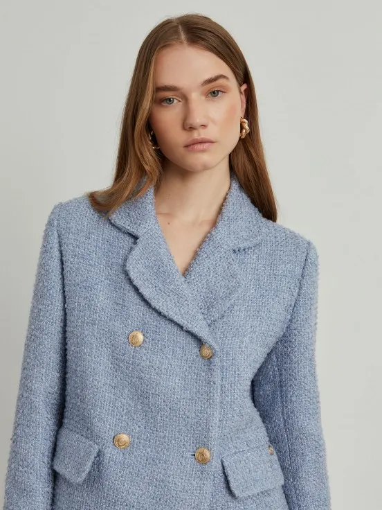 Tweed jacket with cross-over design and handy pockets.